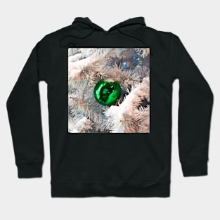 Green ball on white branches of Christmas tree Hoodie